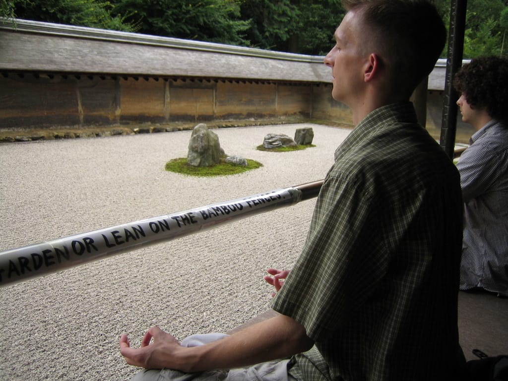 Brandon meditating at the zen garden