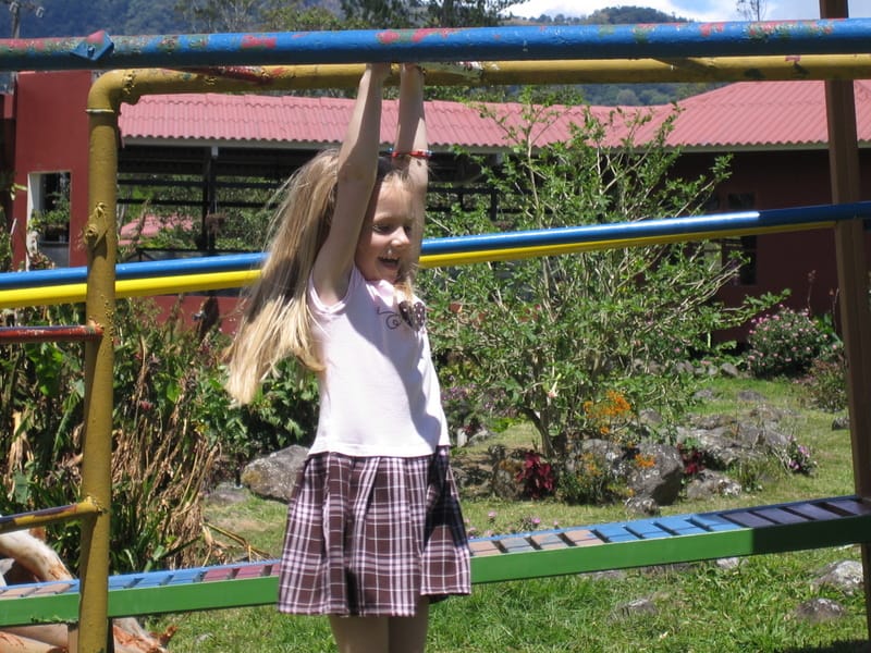 Emily on the monkey bars