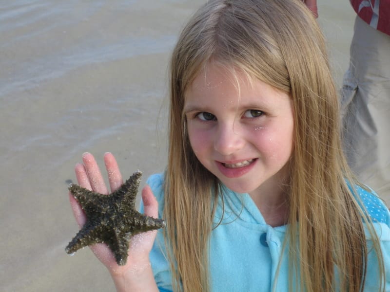 Emily holding a starfish
