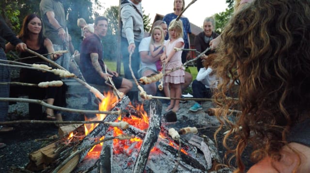 Baking bread over the fire during Peace Week